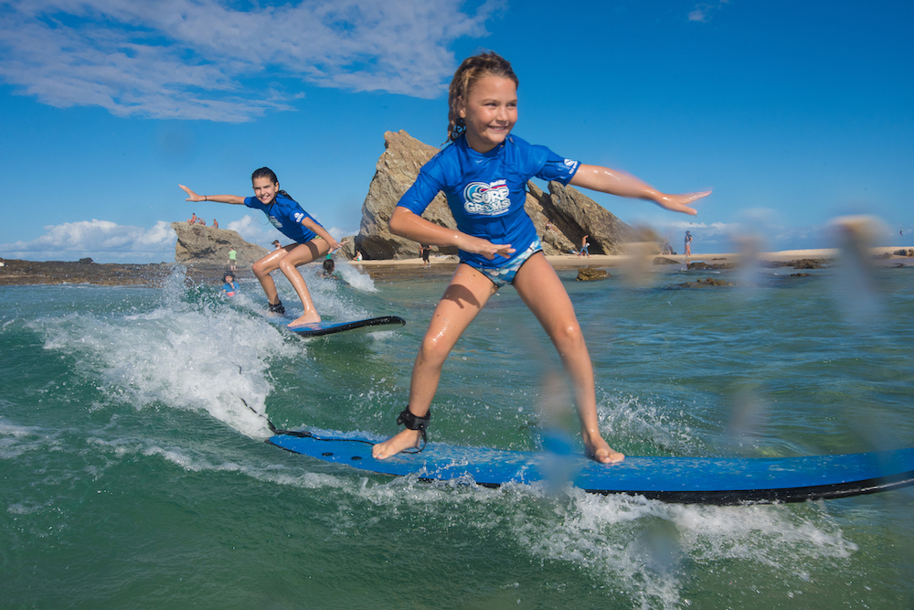 Learn to surf with Surfing Services. SurfGroms term time programs and holidays programs available.